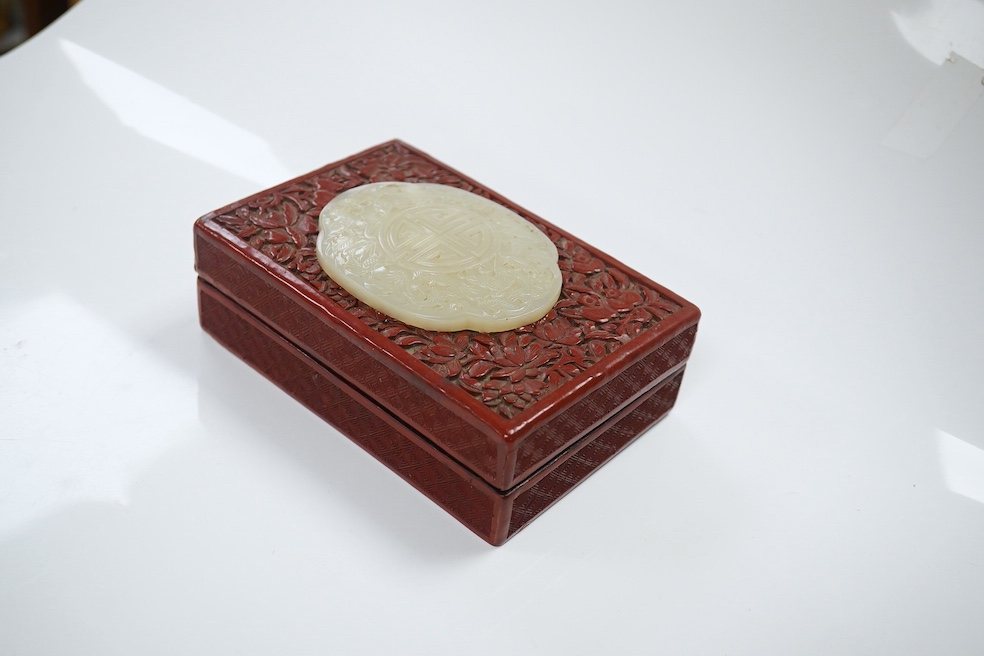 A Chinese carved jade mounted cinnabar lacquer box, 19th / 20th century, 14cm wide. Condition - fair, commensurate with age